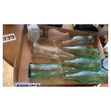 Coke bottles and mini oil lamp