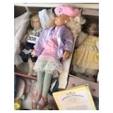 (3) collectible dolls.