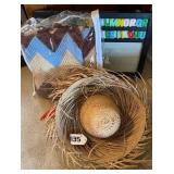 Straw hat, blanket, and magnetic alphabet board