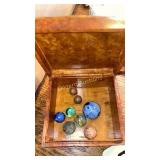 Marbles in wood storage box