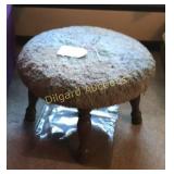 Wooden stool with cushioned top