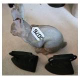 Concrete rabbit and sad irons