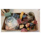 Letter blocks, covered food dish, mug, more