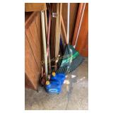 Pile of yard sticks, rakes and more