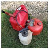 Fuel cans and sprayer (large is approx 1/4 full)