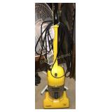 Vacuum cleaner and fan on stand