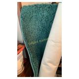 Green carpet rolled up