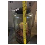 Tall glass container with metal lid