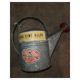 Galvanized water can with light attachment