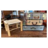 Vintage suite cases and wooden stools