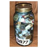 Canning jar full of misc buttons