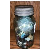 Canning jar full of buttons
