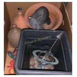 Sunclock, clay pots, and figurines