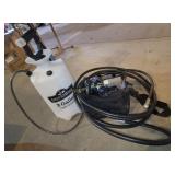 2 gallon pump sprayer, Olympus camera, hose