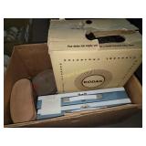 Kodak carousel projector, empty slide cases