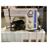 White sewing machine and accessories