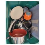 Various pots and pans, and many lids