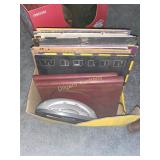 Alarm clock, record albums, photo albums