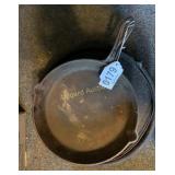 Cast iron skillet on tripod