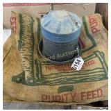 Feed sack and National Ideal chicken feeder