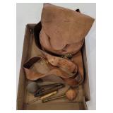 Leather pouch with tools (black powder?)