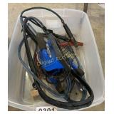 Tote, jumper cables, and shop light