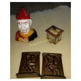 Cast iron clown, mechanical bank, bookends, more