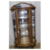 Lighted curved glass curio cabinet