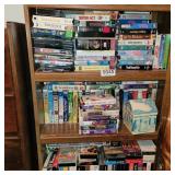 VHS tapes and DVDs (bottom 3 shelves)