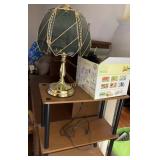 Shelving unit (44'), lamp, hair accessories