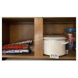 Westbend Crock pot, water jug and aluminum foil