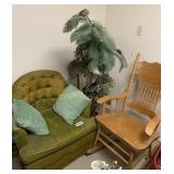 Wooden rocking chair, upholstered chair and plant