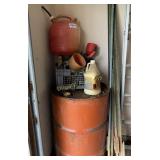 Gas can metal barrel and fence posts