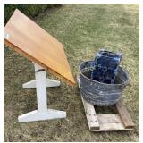 Drafting table, tub, creeper