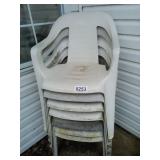 7 weathered plastic chairs