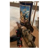 Tin with trimmer, batteries and charger, hacksaw