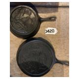 (2) cast iron skillets (Duck & Fish)