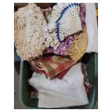 Tote of doilies, afghans and quilt