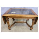 Glass top drop leaf coffee table