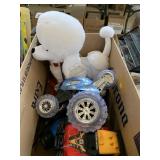 Toy trucks, remote control cars and stuffed dog