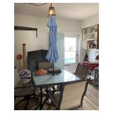 Glass top patio table swivel chairs and umbrella