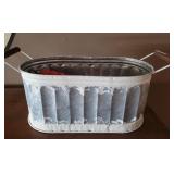Galvanized container with kitchen utensils