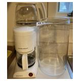 Coffeemaker, pot and glass candle cylinder