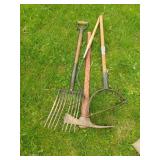 Pick axes, hay fork and weed whackers