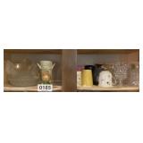 Shelf of cups, glasses , hen on nest and more