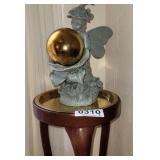 Plant stand and fairy statue