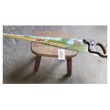 Wood stool and painted saw
