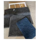 Entryway carpets, window, corkboard