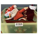 Christmas throw pillows and stuffed figurines