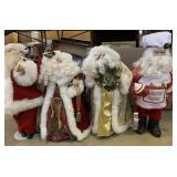 Sterilite tote, Santa tree toppers and figurines